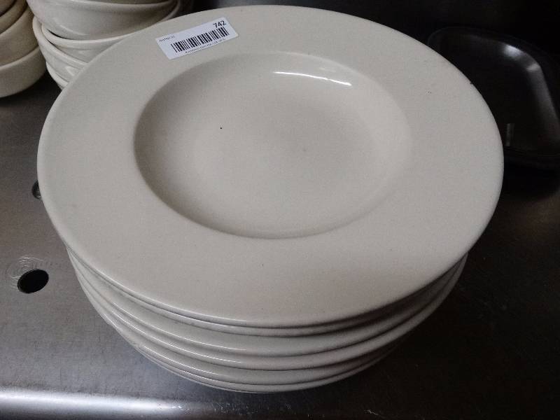 lot 742 image: 8 large ceramic pasta bowls. Few have chips.