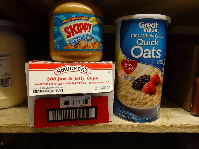 lot 779 image: Jam & jelly, open peanut butter, & open oats.