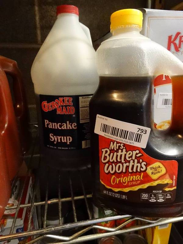 lot 793 image: 2 Open bottle of syrup.