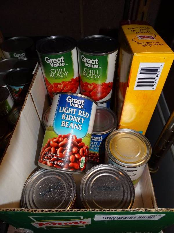 lot 797 image: Can beans, can tomato, taco shells.