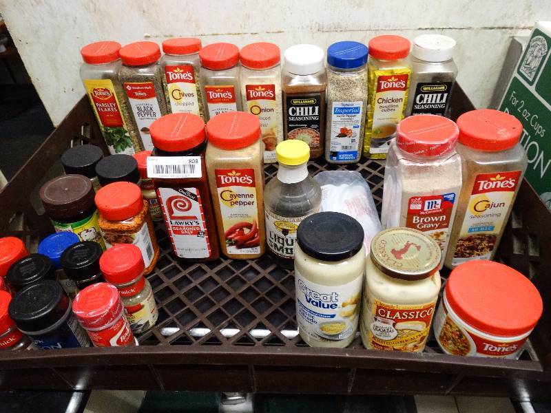 lot 808 image: Rack of assorted spices,