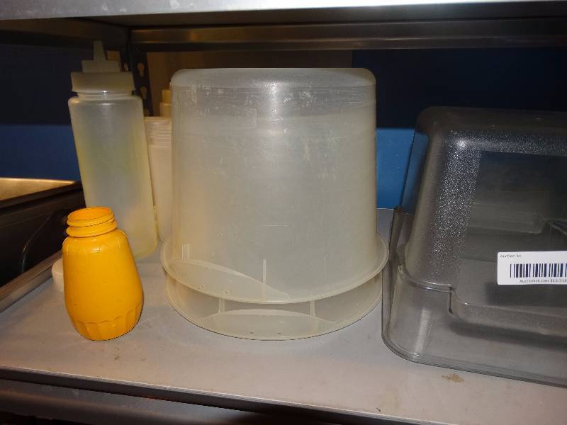 lot 822 image: Plastic kitchen ware, dishes, kitchen tubs. & condiment bottles.