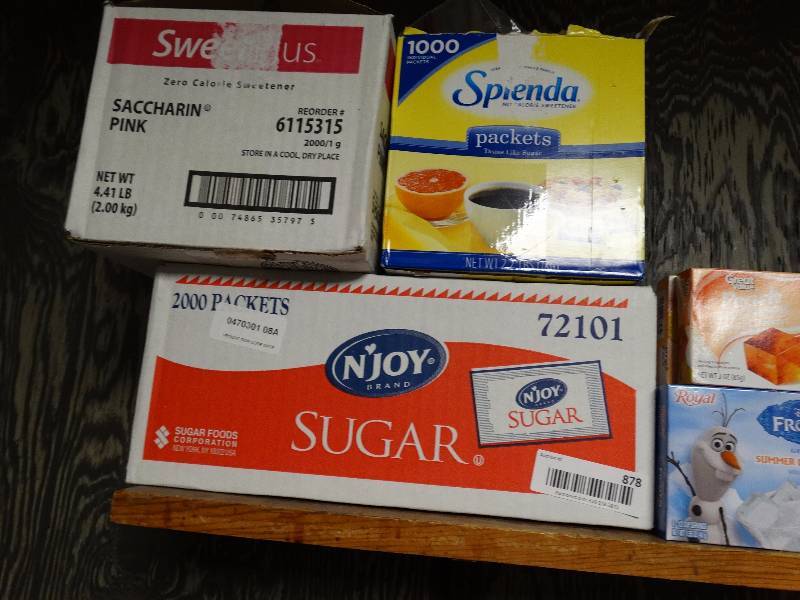 lot 878 image: Box of sugar packets, sweetener packets, misc.