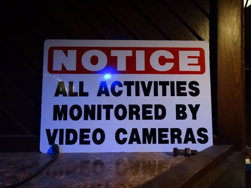 lot 889 image: Metal camera in use sign