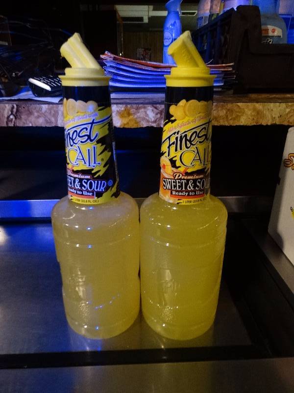 lot 897 image: 2 unopened bottles of Sweet & Sour