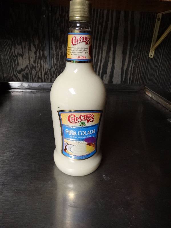 lot 906 image: Unopened bottle of Pina Colada mixer