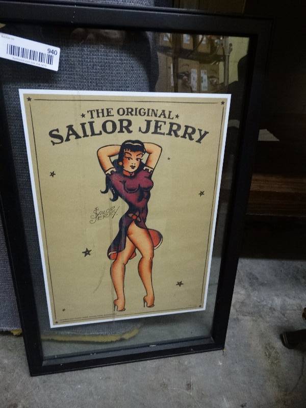lot 940 image: Framed Sailor Jerry ad