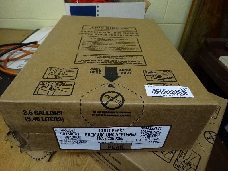 lot 944 image: 2.5 gallon unopened Gold Peak unsweet tea- In date