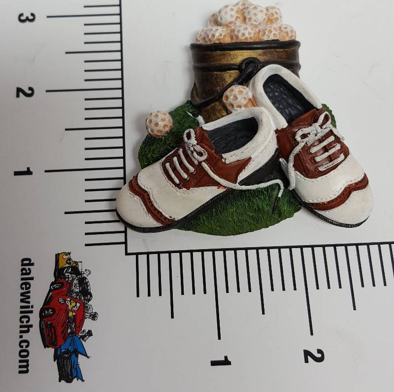 lot 6121 image: New 3 dimensional plastic fridge magnet of a golfers shoes, balls and bag.