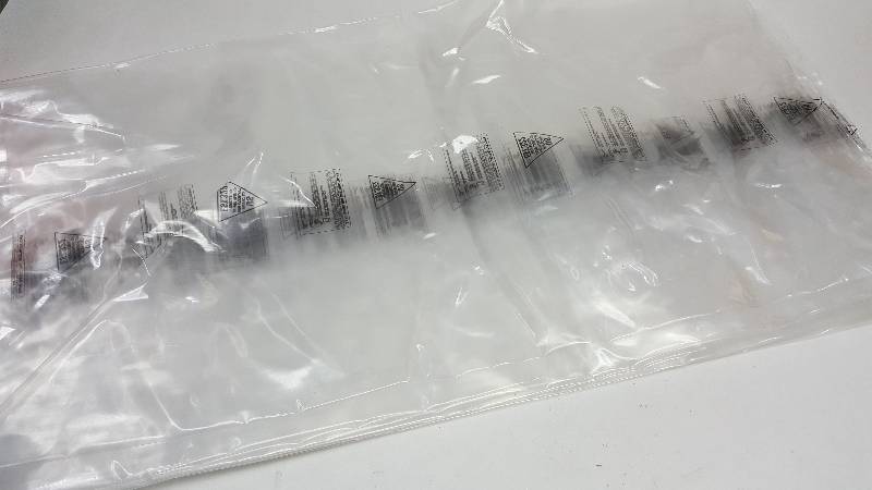 lot 6145 image: Dozen (12) Very heavy (not sure of mill thickness) clear plastic bags designed for meat processing