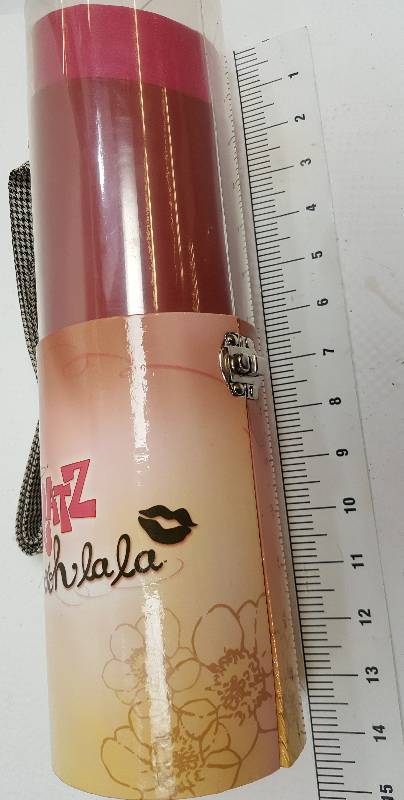 lot 6066 image: Bratz Ooh La La Lipgloss Carrying Case This is a carrying case for dolls shaped like a lipstick.