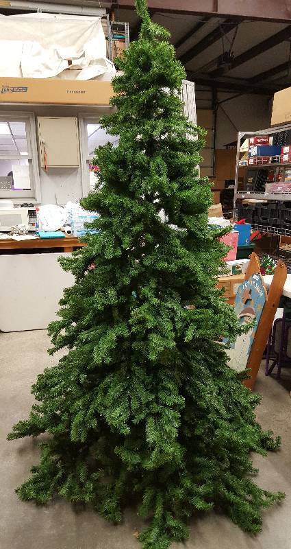 lot 5964 image: Nebraska Pine Tree 7 12 Foot. Looks like a real tree and beautiful after decorated.  Easy to assemble- Comes in three different sections.