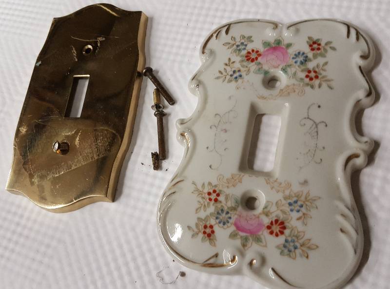 lot 5963 image: Light switch covers- one brass and other ceramic