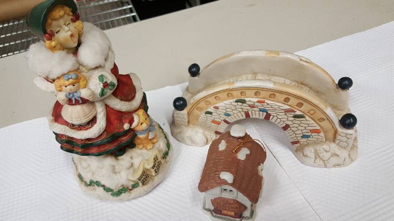 lot 5970 image: Caroler and gingerbread house with a decorative bridge for the pond