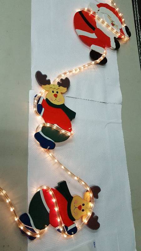 lot 5975 image: Rope lighting with Santa and a couple of reindeer for outside decoration this Christmas