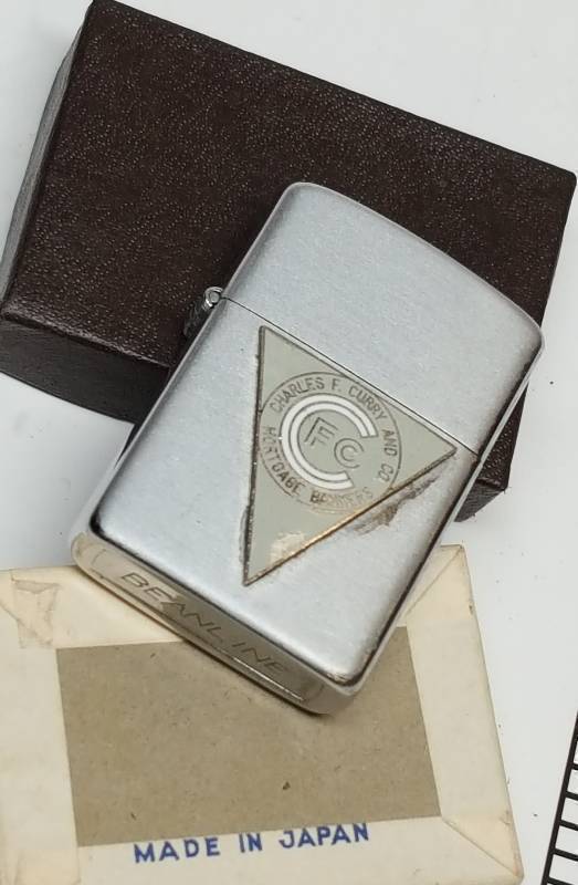 lot 7383 image: Cigarette lighter, most likely from the 70s as a promotional give a way by the local Kansas City company