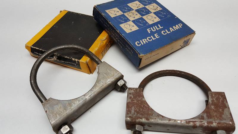 lot 6035 image: A couple of new in the old boxes big 2-12 OD muffler clamps