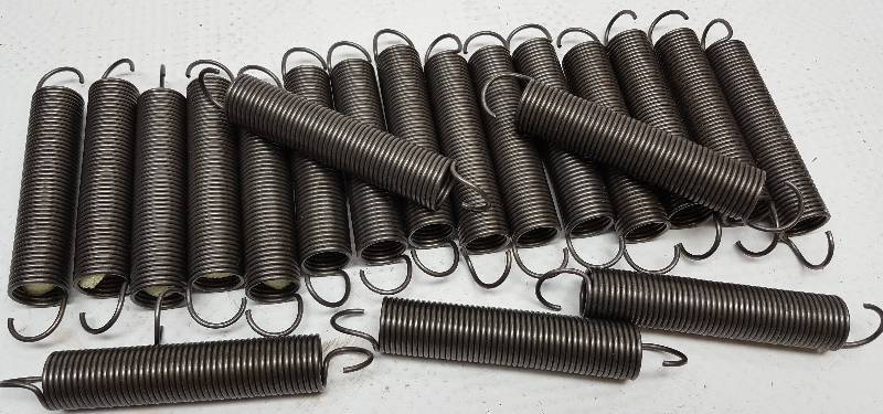 lot 6153 image: Package of 20 individual 5 overall length universal springs with harmonic dampener inside.