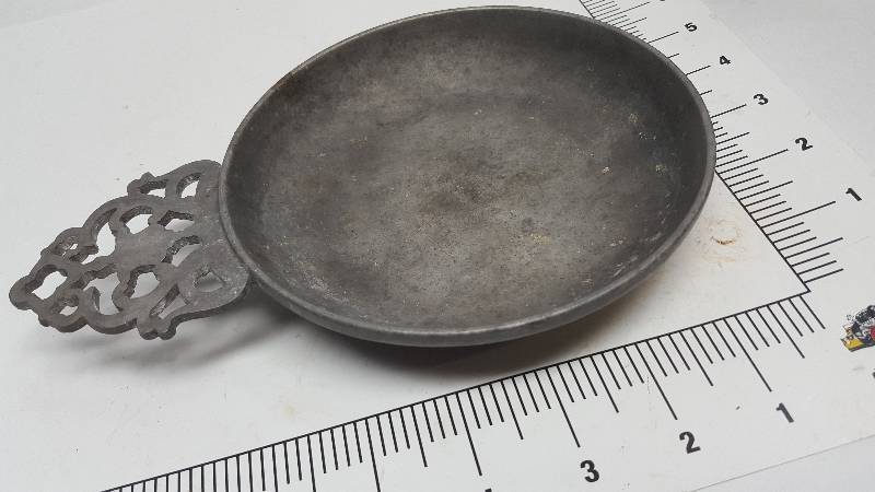lot 6569 image: Just for decoration is the Pewter counter top dish or ash tray for the deck