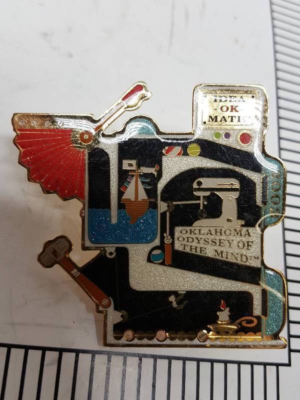 lot 8718 image: Another one of those collectable hat or lapel pins most are finished with wild porcelain colors.