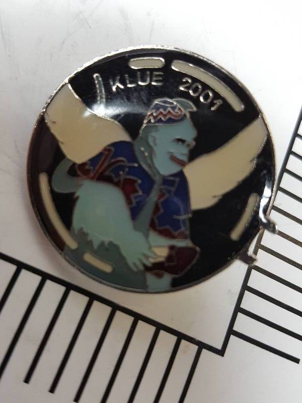 lot 8719 image: Another one of those collectable hat or lapel pins most are finished with wild porcelain colors.