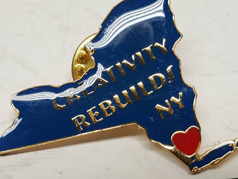 lot 8735 image: Another one of those collectable hat or lapel pins most are finished with wild porcelain colors.