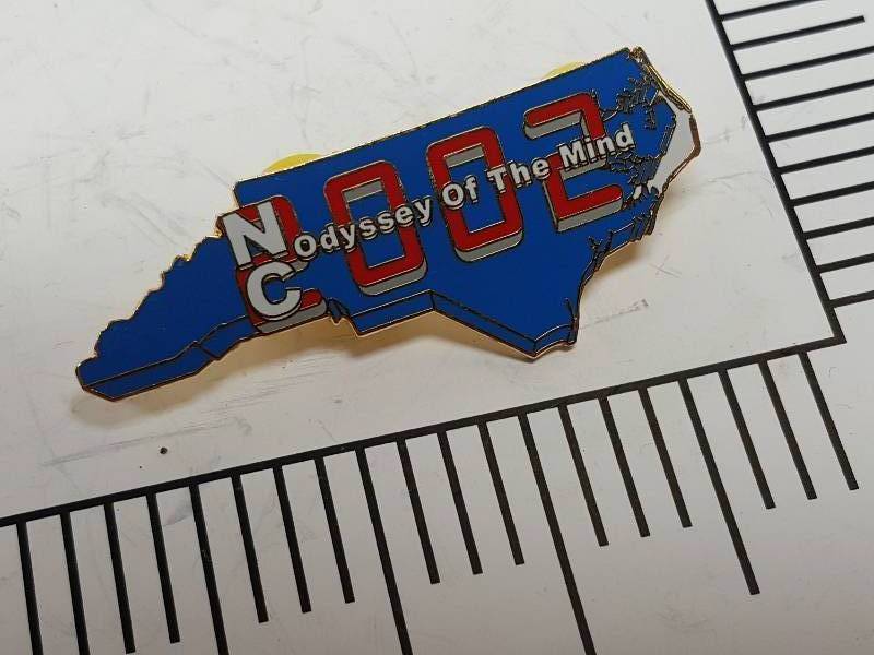 lot 8740 image: Another one of those collectable hat or lapel pins most are finished with wild porcelain colors.