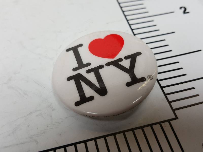 lot 8749 image: Another one of those collectable hat or lapel pins most are finished with wild porcelain colors.