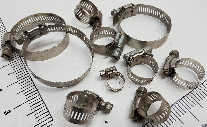 lot 6007 image: 10 of these I believe new stainless hose screw clamps in assorted sizes.