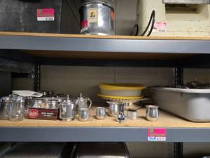 lot 41009 image: Contents Of Shelf W Silverware, Shakers, And More