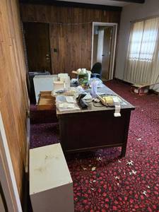 lot 41027 image: Contents Of Room W Desk , File Cabinets, Wood Walls, And More