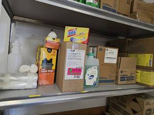 lot 37486 image: Contents Of Shelf W Trash Bags Hand Soap Refills, And More