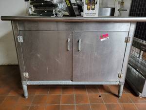 lot 31566 image: Stainless Steel Table W Cabinet Doors
