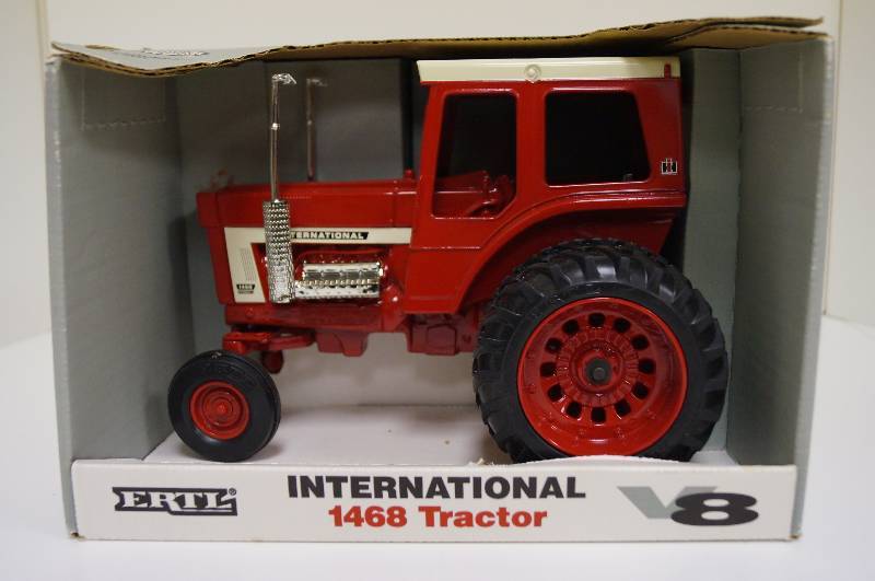 lot 2043 image: ERTL International 1468 Tractor, 116, #4601,  chrome plated mufflers, rear duals, NIB