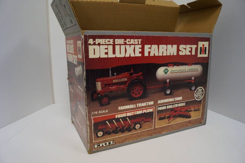 lot 2045 image: ERTL Farmall 4-piece Deluxe Farm Set, 116, 350 Tractor, 4 bottom plow, disc, ammonia Tank, NIB