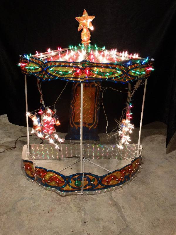 lot 444 image: Motion Christmas carousel outdoor decor