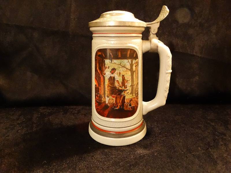 lot 492 image: Avon 1985 Blacksmith theme Beer Stein