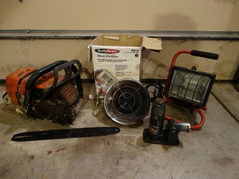 lot 779 image: Misc. lot - Chainsaw for parts only, Heater, light-may not work, Jack.