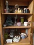 Glassware & collectible in cabinet.