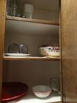 Contents of cabinet, dinnerware, glassware and misc..