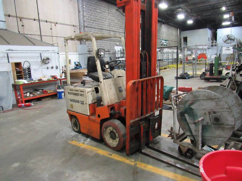 lot 1228 image: Nissan 2500 Lb. Capacity Triple Mast Electric Fork Lift