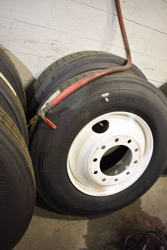 lot 1416D image: Pair Of New Semi Tires And Wheels