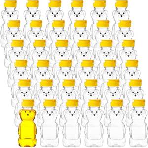 lot 31376 image: Thenshop 36 Pieces Plastic Empty Honey Bear Bottle Honey Squeeze Bottle Honey Bear Cup with Yellow Flip Top Lid Bear Shaped Jar Honey Containers for Juice Storing and Dispensing(240 ml 8 oz)