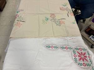 lot 8 image: Vintage table cloths, fall embroidery, Christmas cross stitch