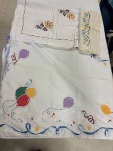 lot 9 image: 2 vintage tablecloths, 1 pillow case, cross stitch embroidered