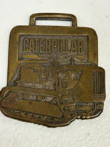lot 34 image: Vintage caterpillar watch Fob, 1956