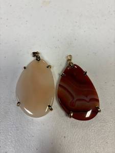 lot 47 image: large flat stone pendants