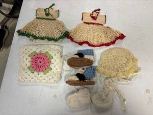 lot 73 image: Crochetknitted baby booties, hot pad, baby cap, doll dresses
