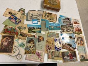 lot 105 image: Vintage cigar box with postcards