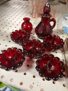 lot 130 image: Red candlestick holders, vase, cruet